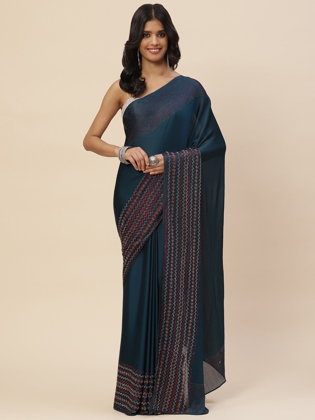 

Meena Bazaar Blue & Red Embellished Saree