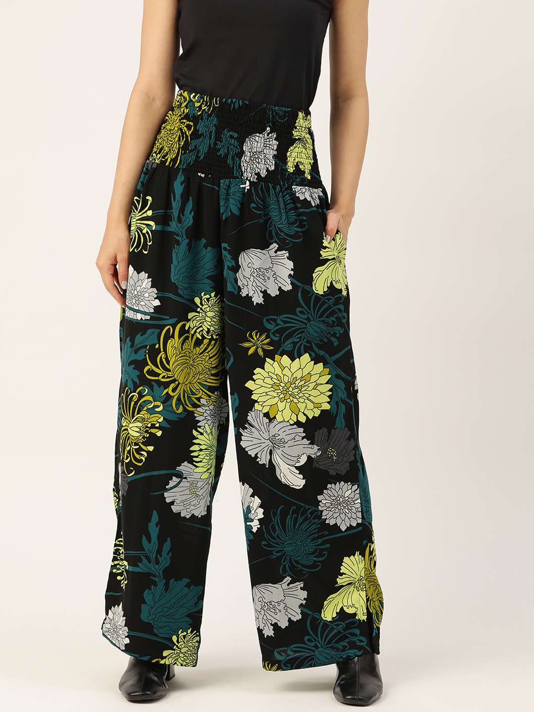 

Antheaa Women Black & Green Floral Printed Comfort Smocked Flared High-Rise Trousers