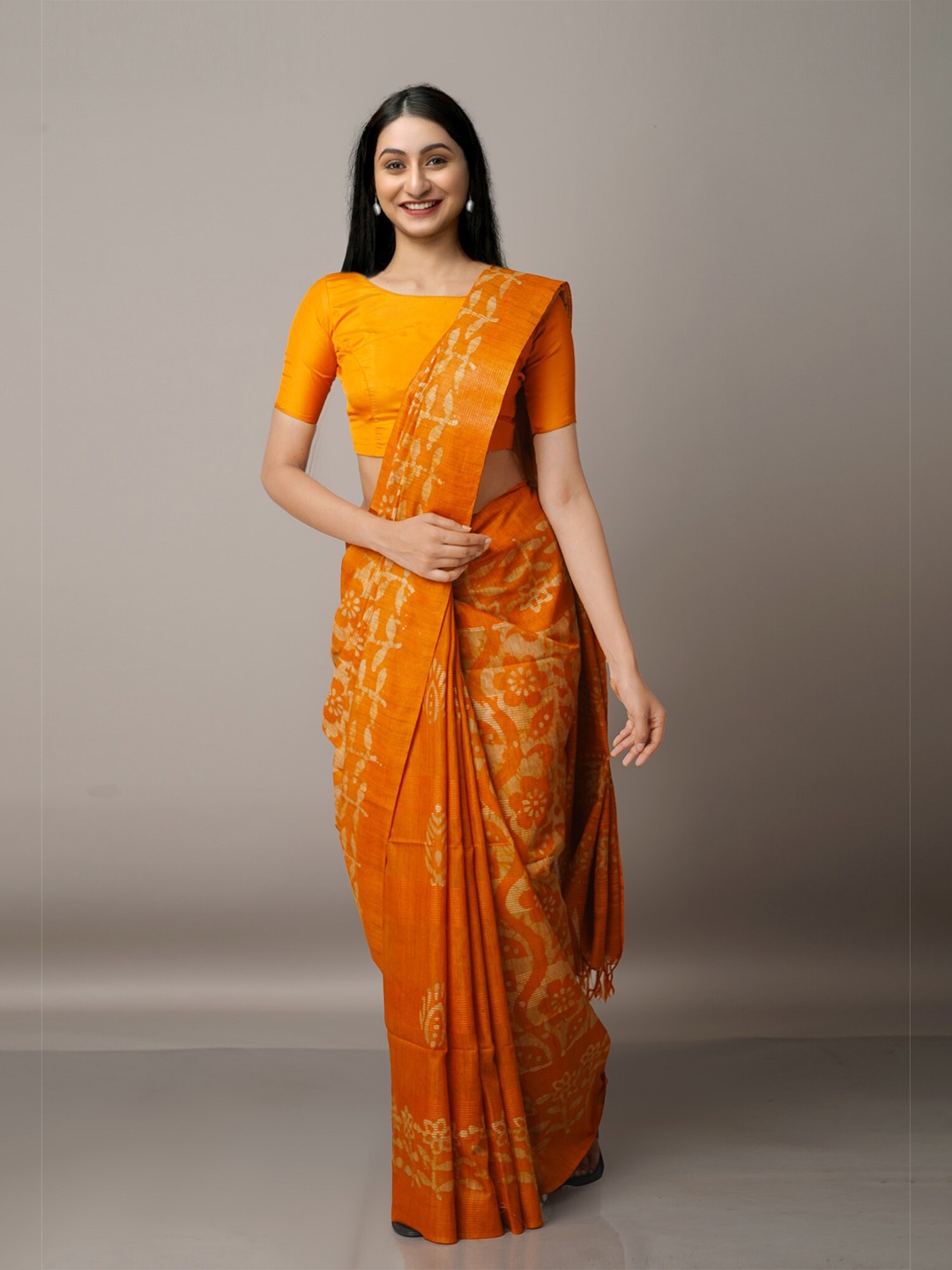 

Unnati Silks Orange & Beige Batik Silk Cotton Bhagalpuri Saree