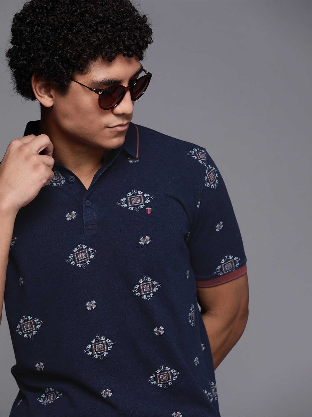

Louis Philippe Jeans Men Navy Blue & Brown Pure Cotton Printed Polo Collar T-shirt