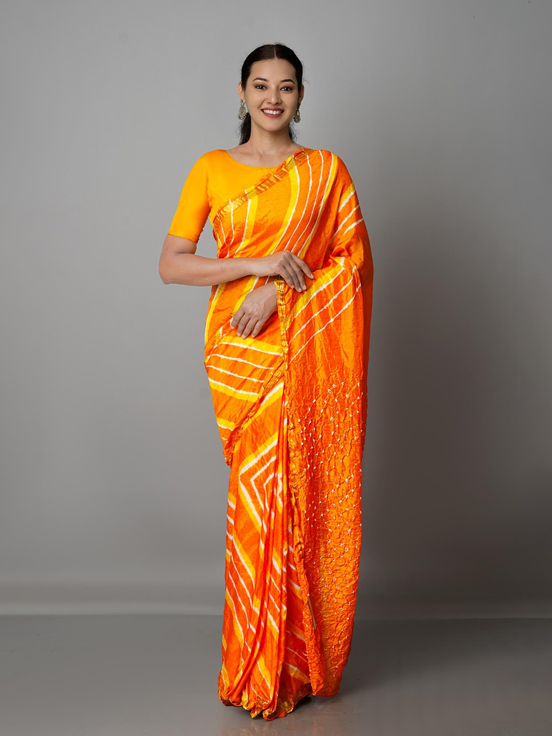 

Unnati Silks Orange & White Bandhani Bandhani Saree