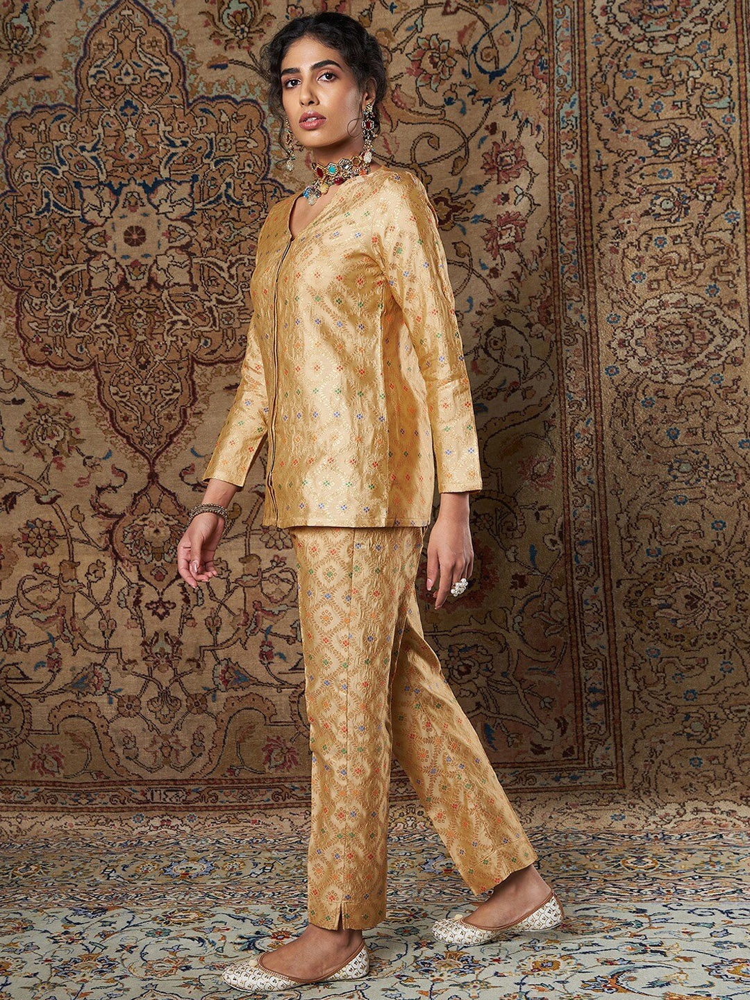 

Shae by SASSAFRAS Women Gold-Toned Ethnic Motifs Printed Tapered Fit Trousers