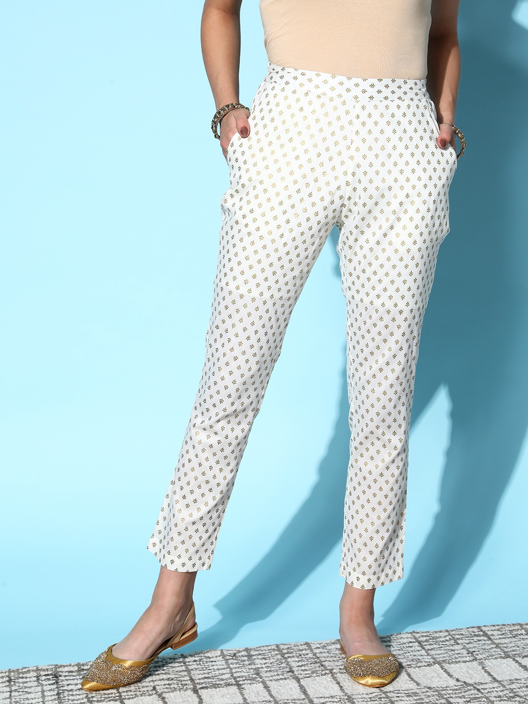 

Shae by SASSAFRAS Women Off White Ethnic Motifs Striped Tapered Fit Trousers