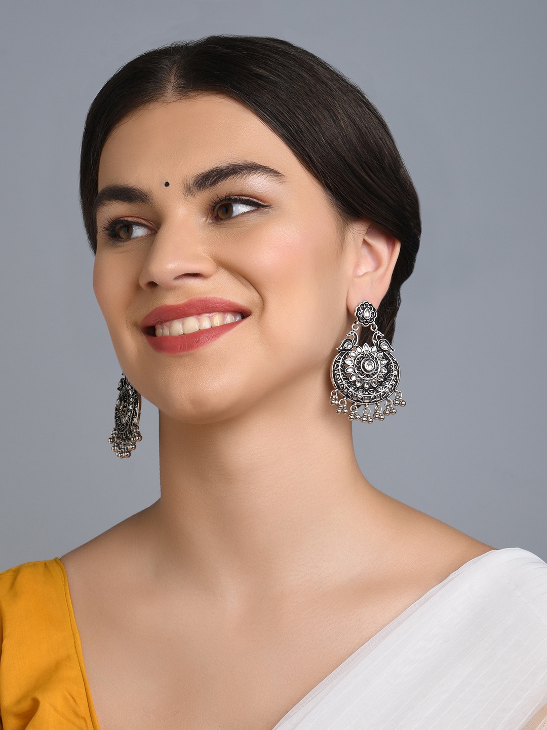 

Fida Silver-Plated Peacock Shaped Drop Earrings