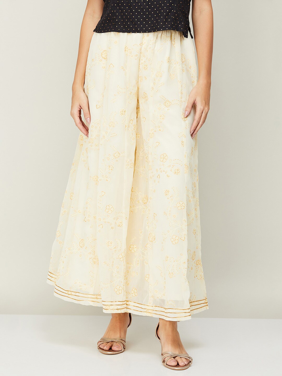 

Melange by Lifestyle Women Beige & Gold-Toned Floral Printed Flared Ethnic Palazzo