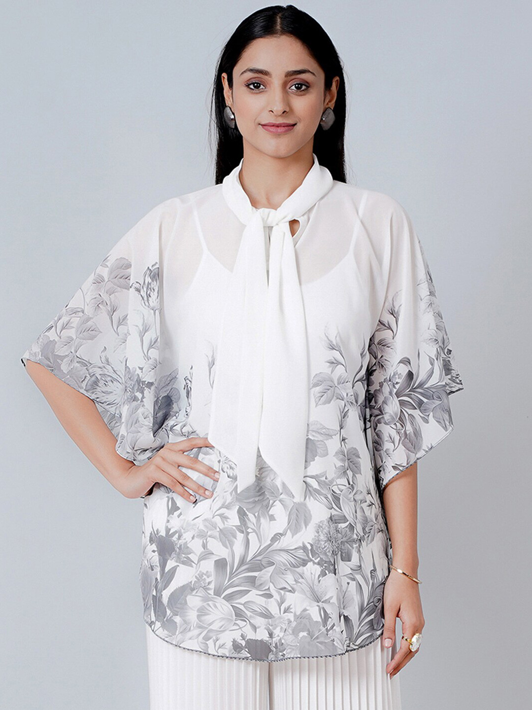 

First Resort by Ramola Bachchan Women Grey Floral Print Tie-Up Neck Georgette Longline Top