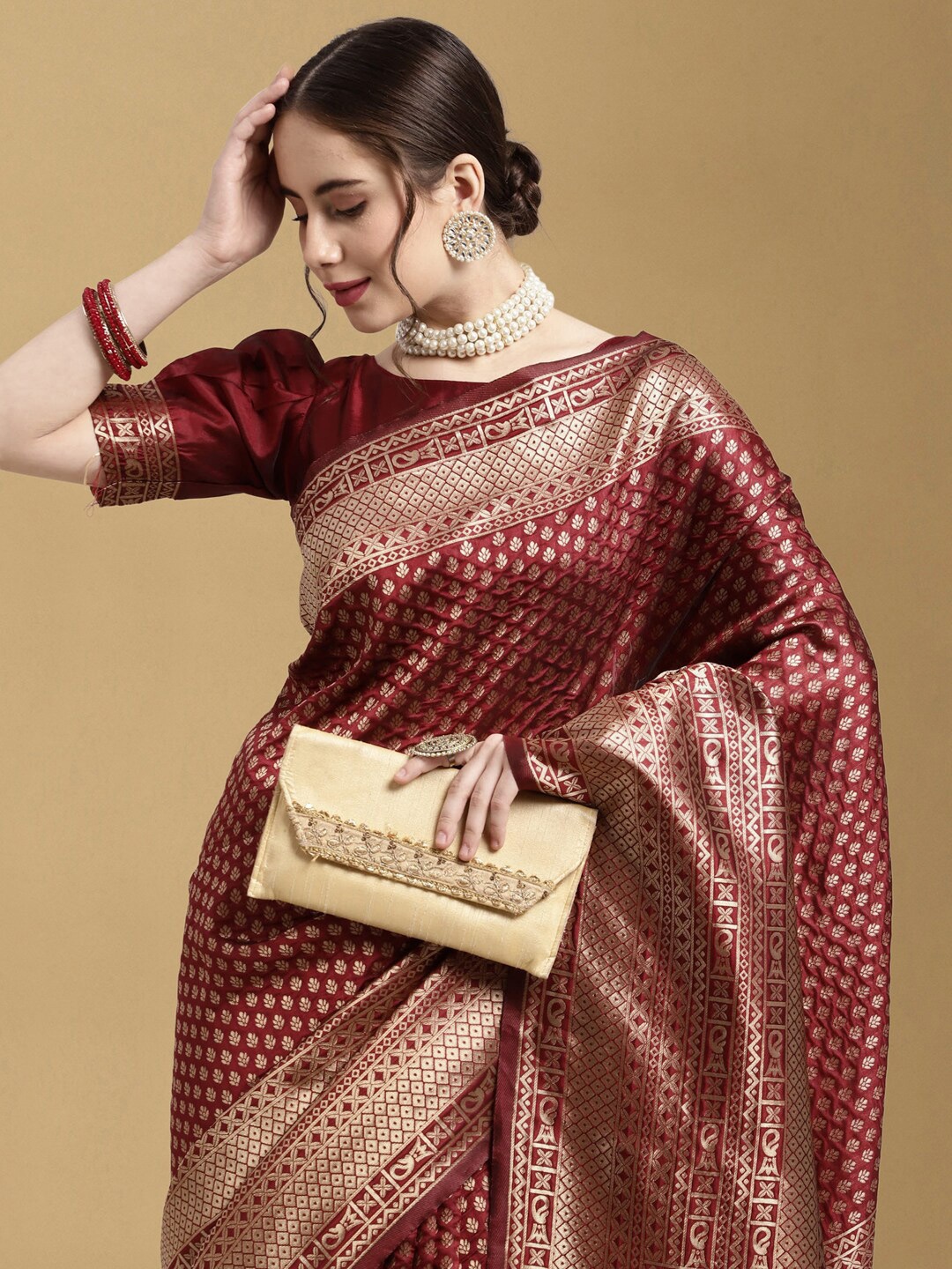 

Satrani Maroon & Gold-Toned Ethnic Motifs Zari Banarasi Saree