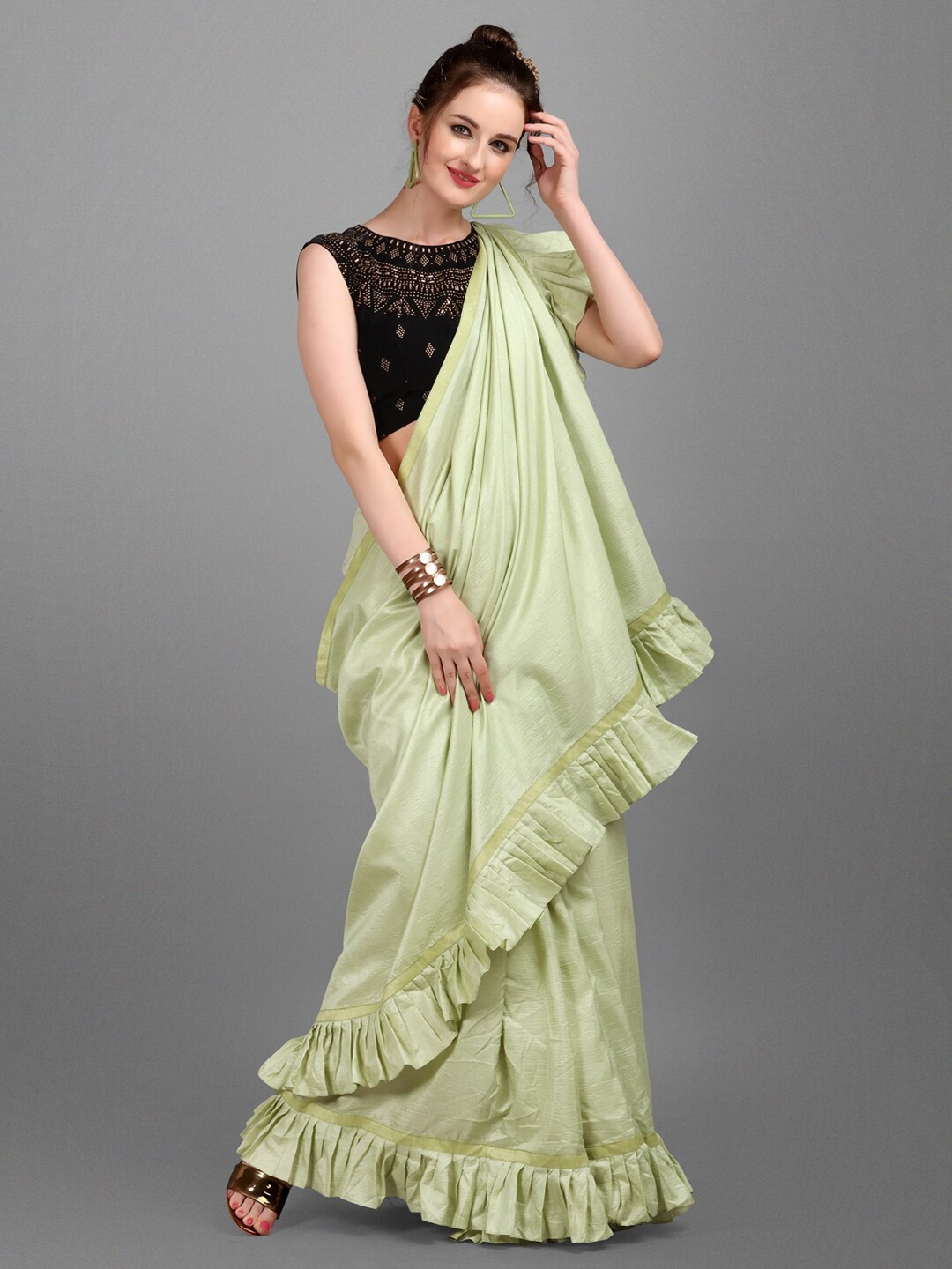 

Ethnic Junction Green Solid Silk Blend Ruffles Saree