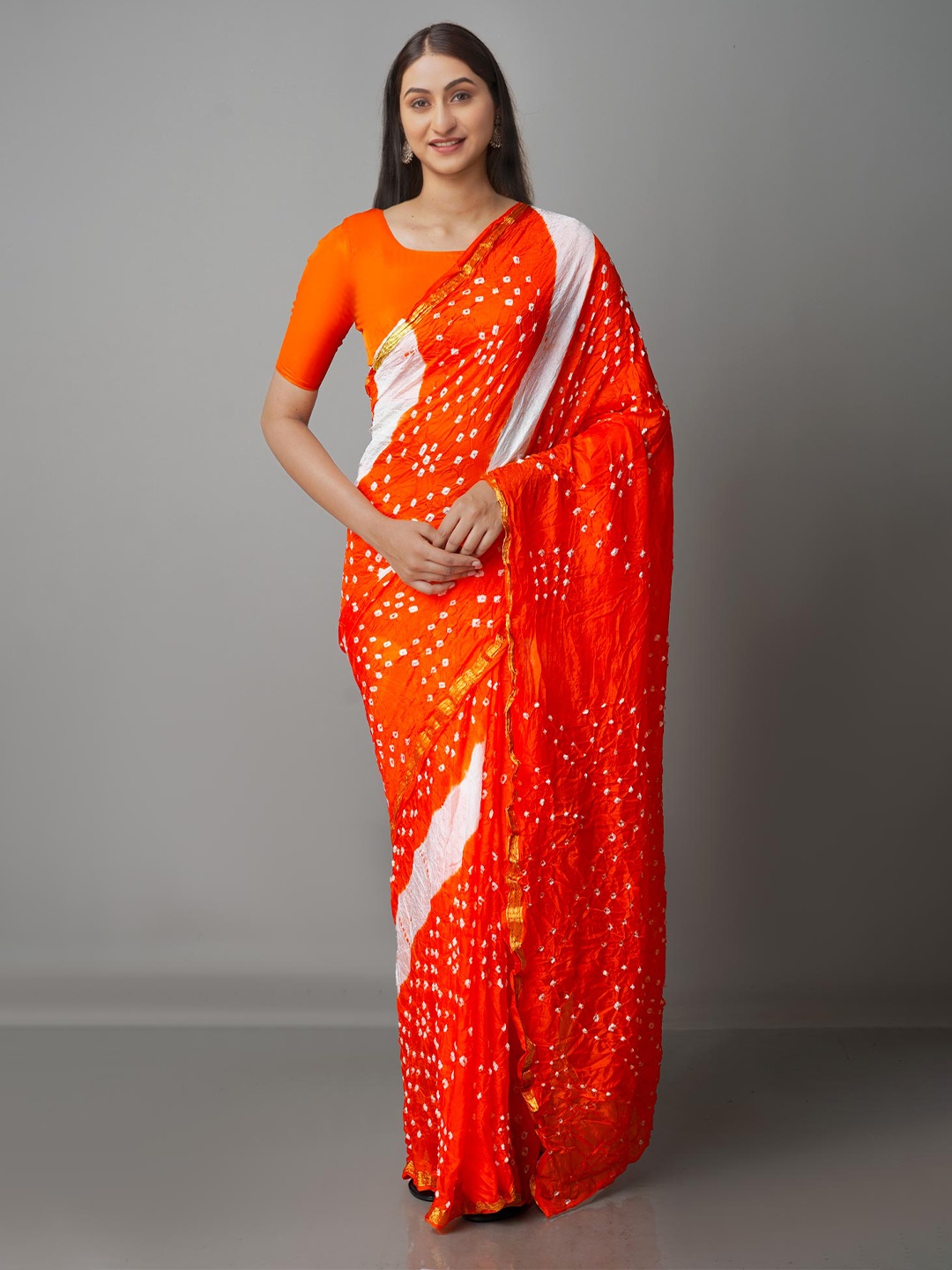 

Unnati Silks Orange & White Bandhani Zari Silk Blend Bandhani Saree