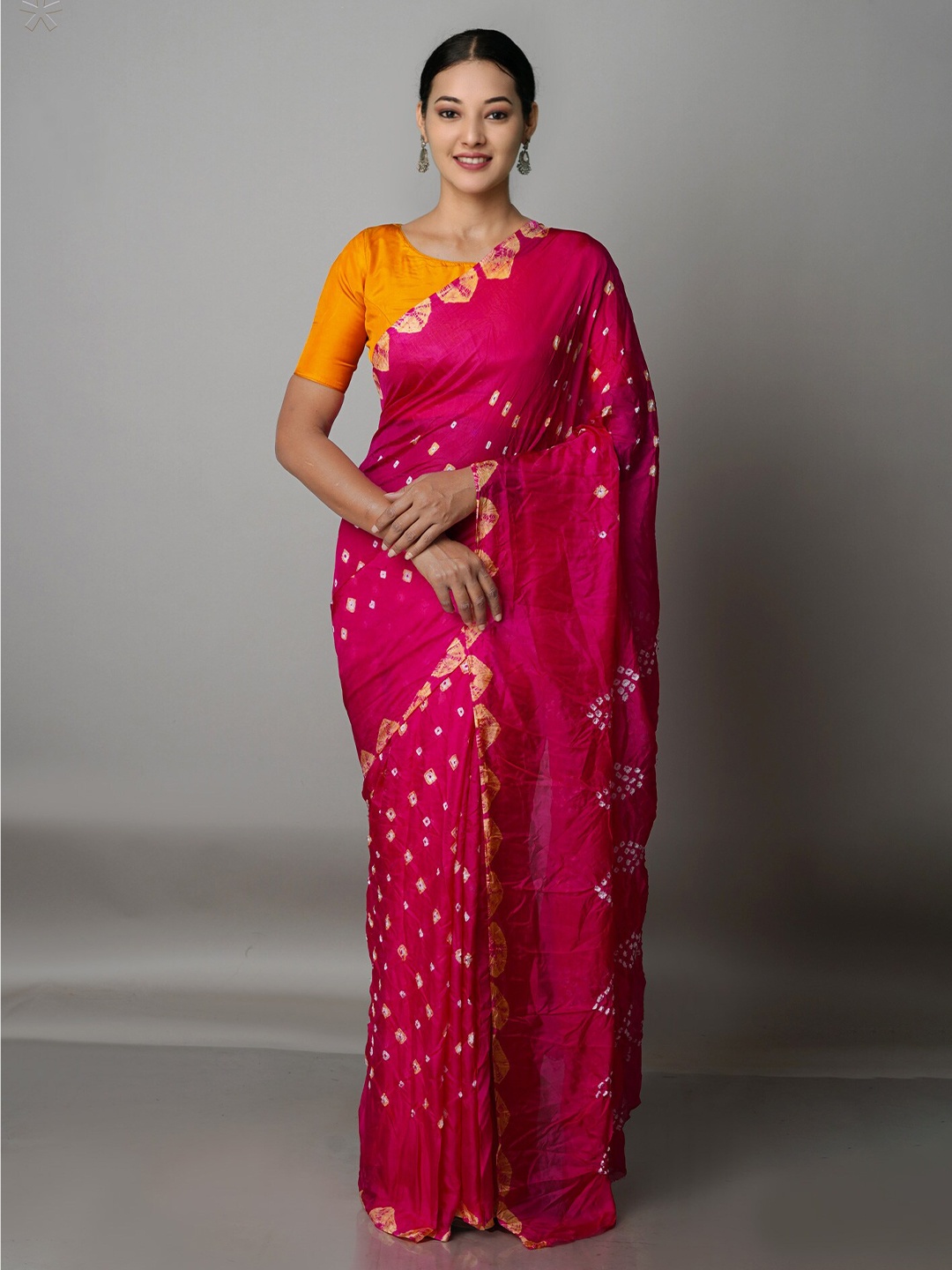 

Unnati Silks Pink & White Bandhani Silk Blend Bandhani Saree