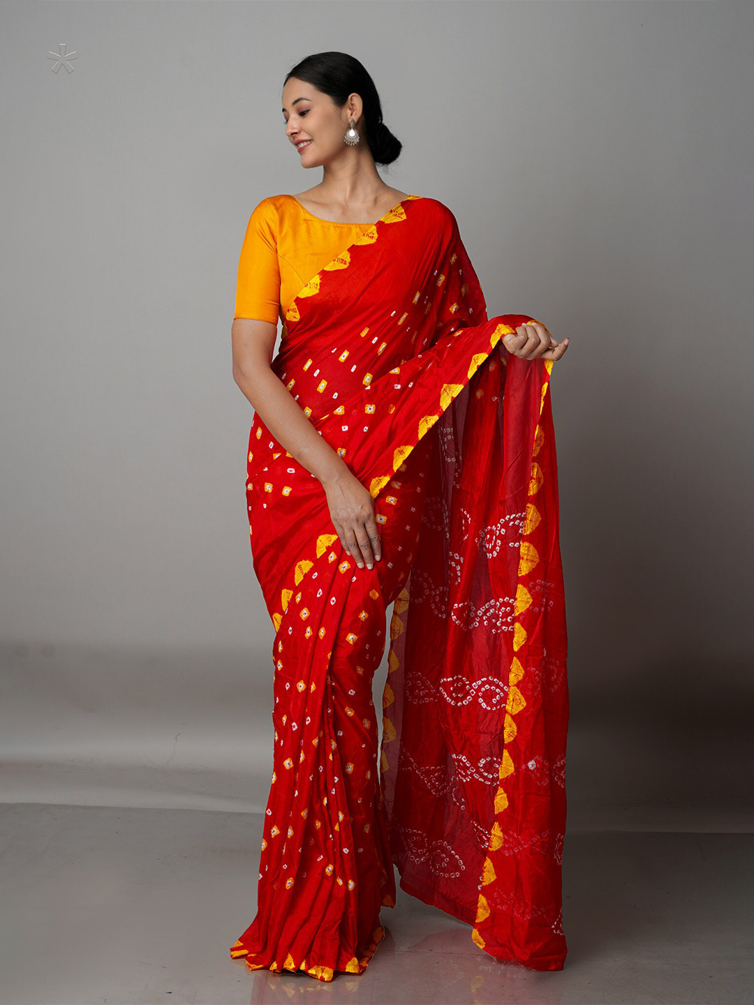 

Unnati Silks Red & Yellow Bandhani Silk Blend Bandhani Saree