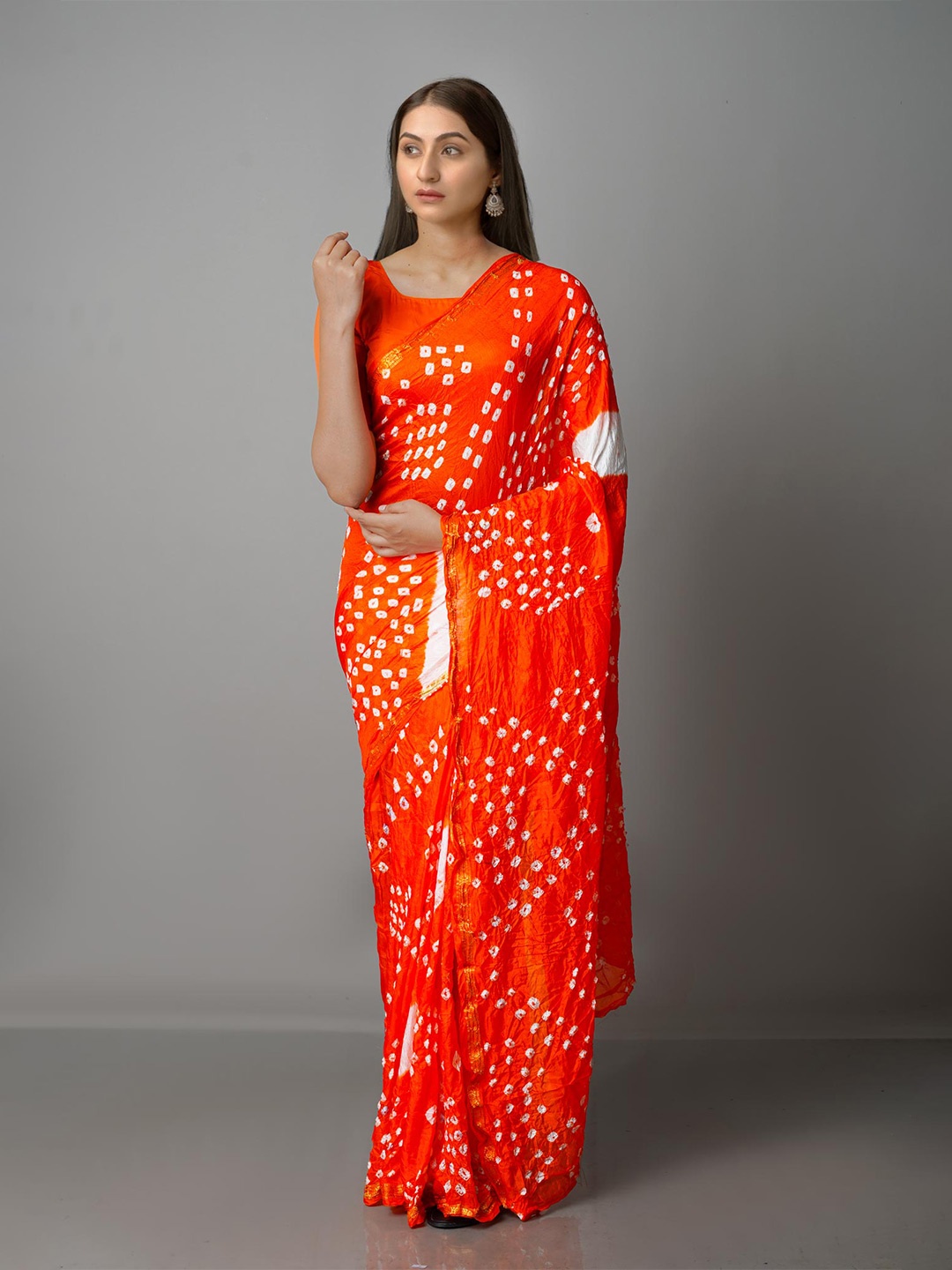 

Unnati Silks Orange & White Bandhani Zari Silk Blend Bandhani Saree