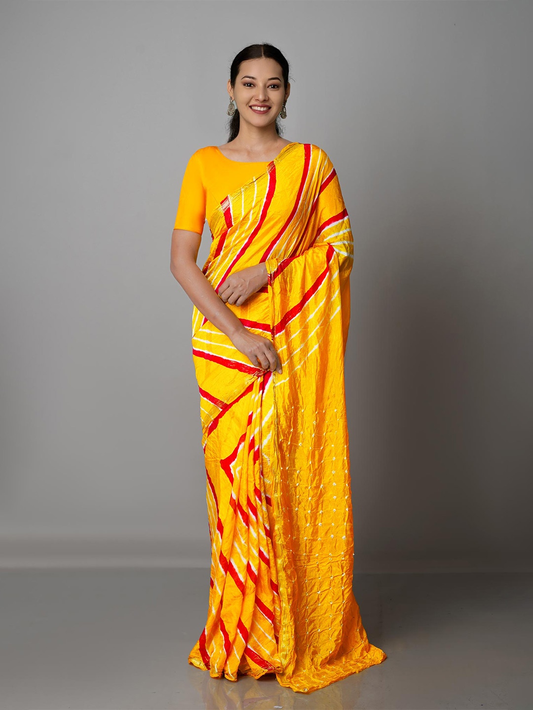 

Unnati Silks Yellow & White Bandhani Silk Blend Bandhani Saree