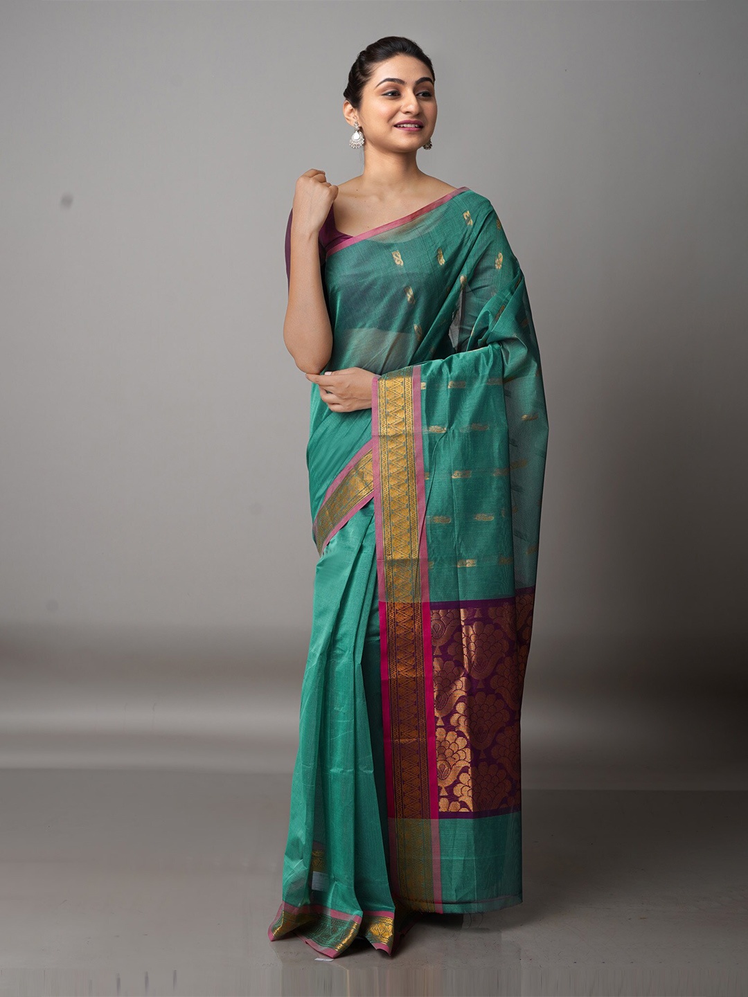 

Unnati Silks Green & Purple Woven Design Zari Pure Cotton Gadwal Saree