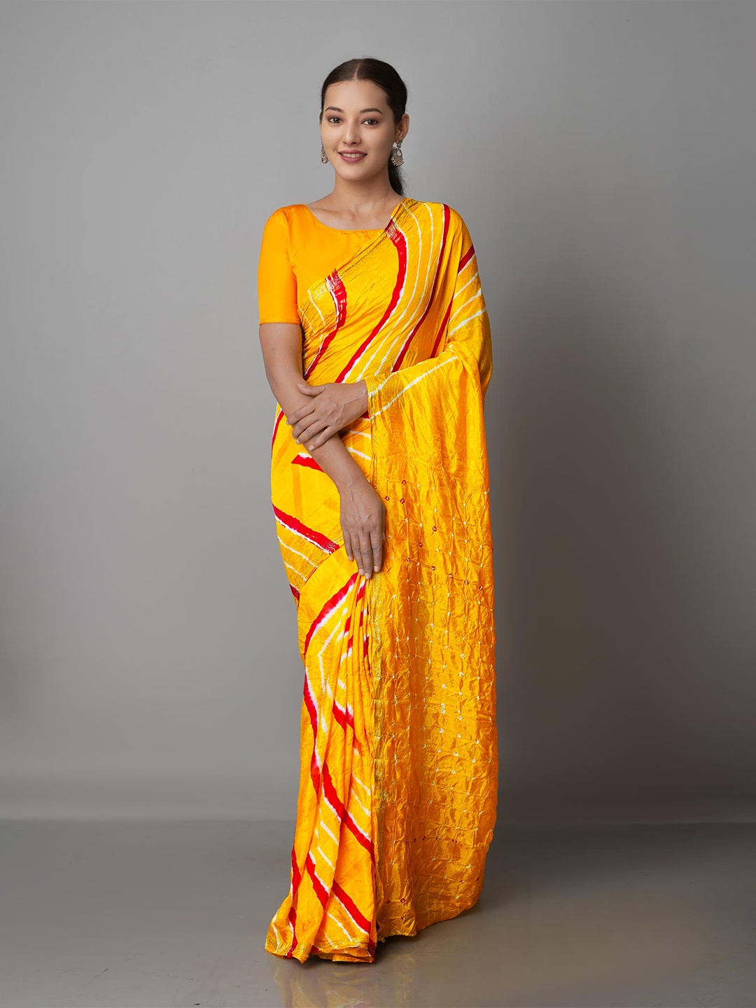 

Unnati Silks Yellow & Red Bandhani Silk Blend Bandhani Saree