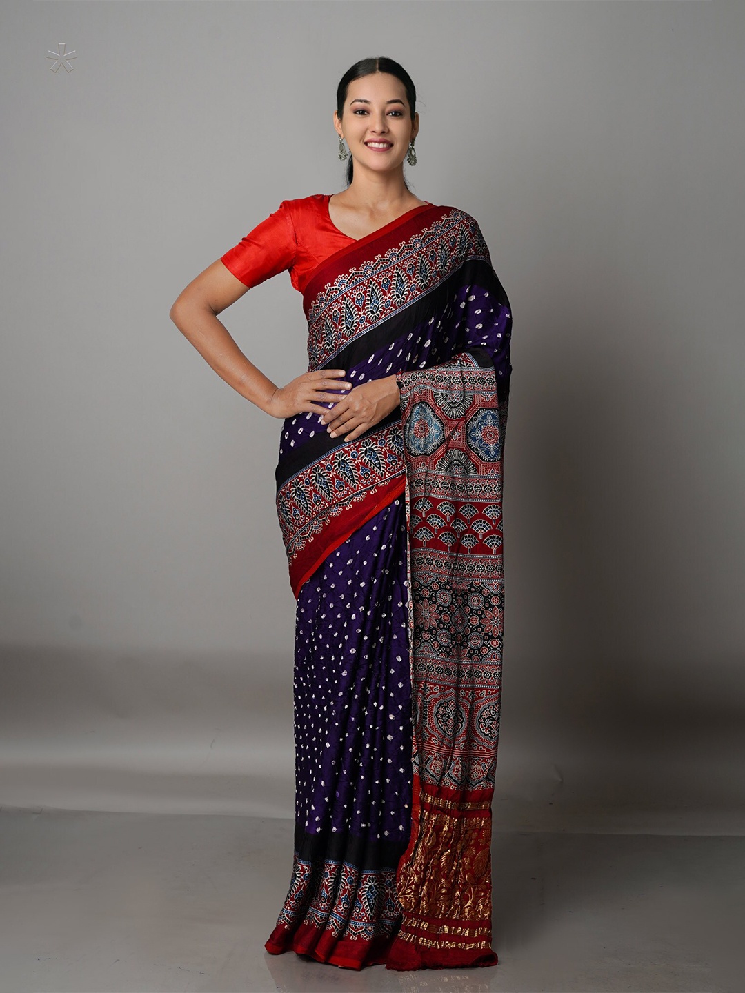 

Unnati Silks Violet & Red Silk Blend Bandhani Saree