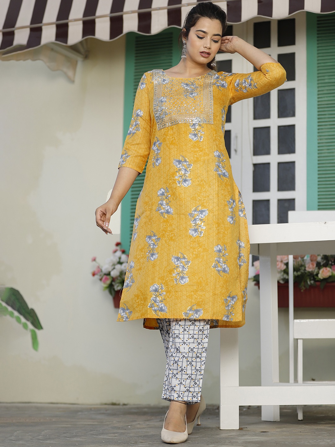 

SINGNI Women Yellow Floral Embroidered Kurta with Trousers