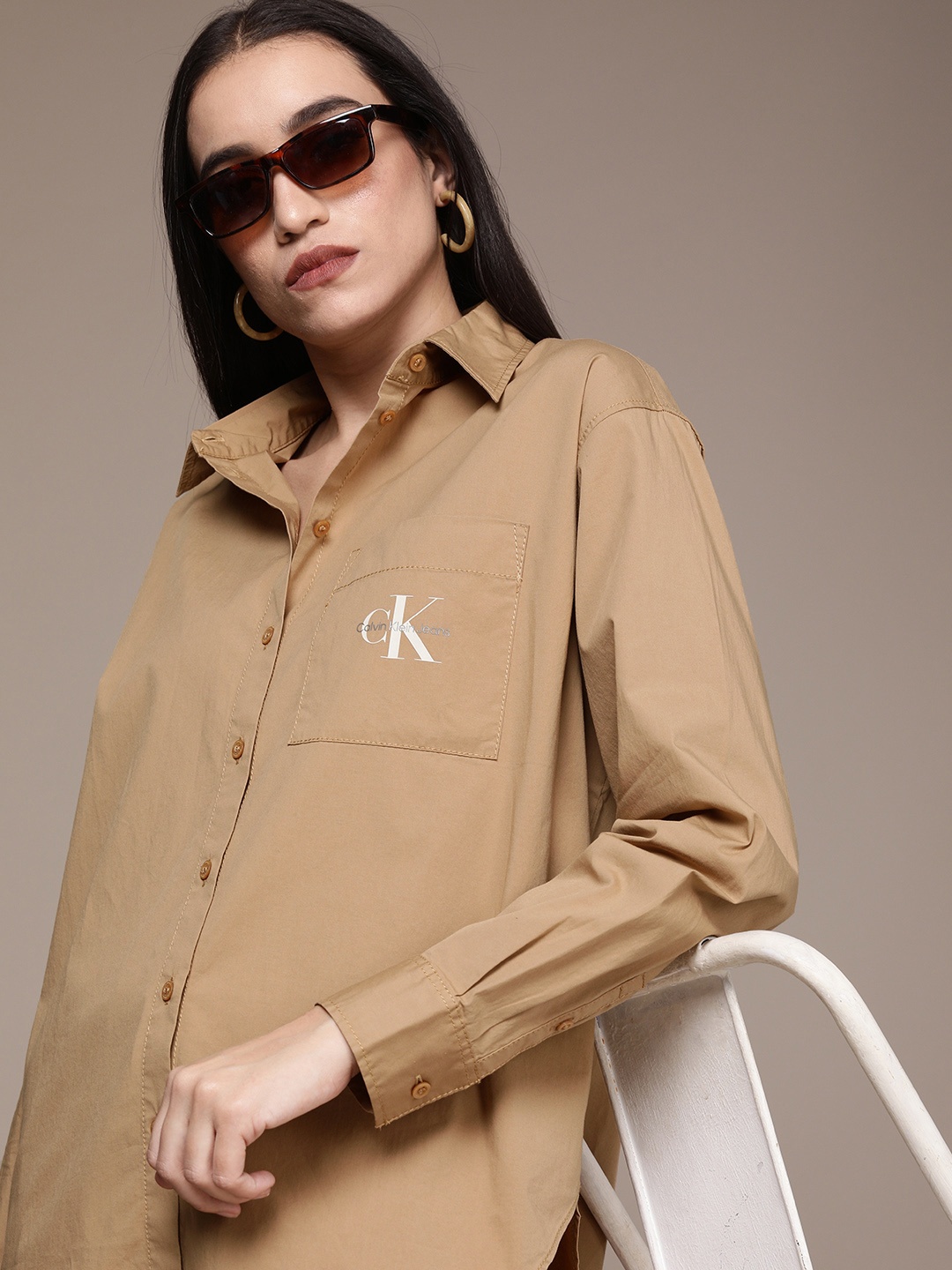 

Calvin Klein Jeans Women Camel Brown Classic Solid Longline Casual Shirt With Brand Logo