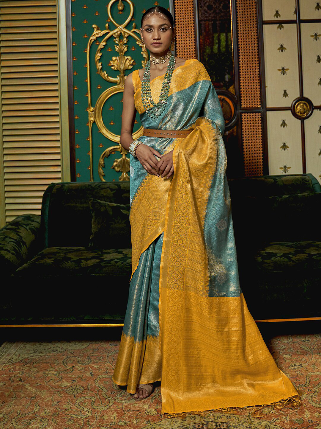 

Mitera Blue & Yellow Ethnic Motifs Zari Silk Blend Banarasi Saree