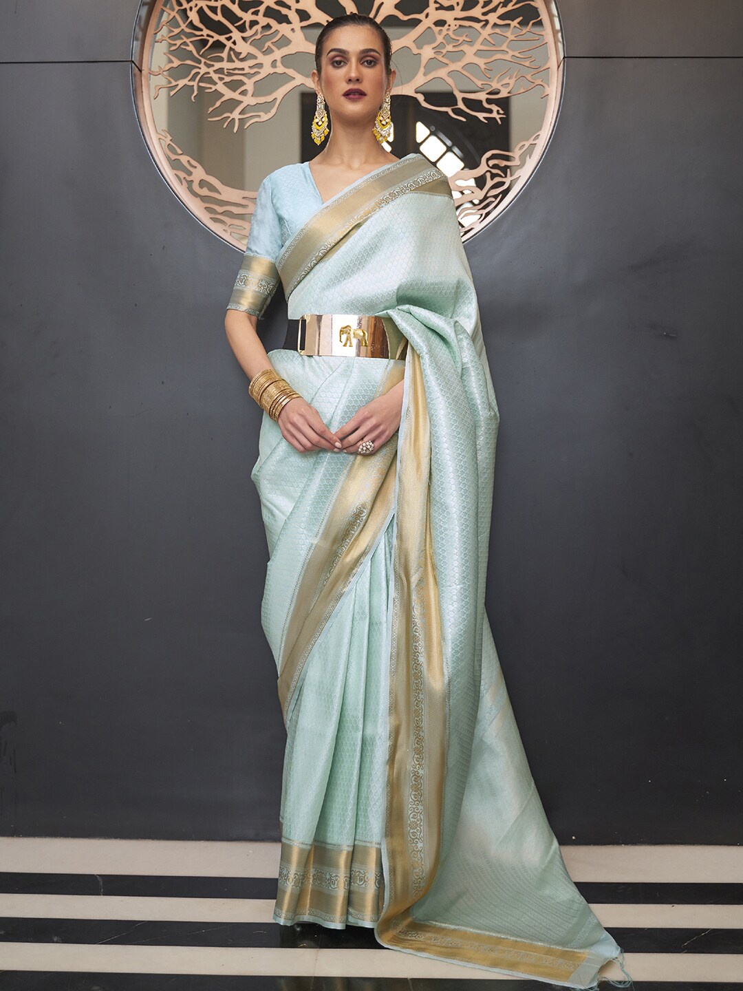 

Mitera Turquoise Blue & Gold-Toned Ethnic Motifs Zari Silk Blend Banarasi Saree