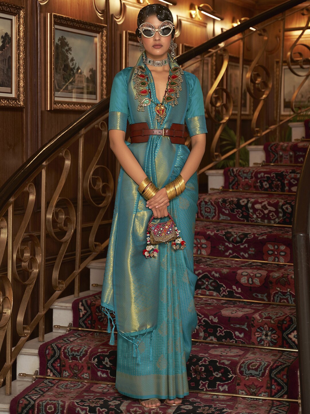 

Mitera Blue & Gold-Toned Ethnic Motifs Zari Silk Blend Bagh Saree