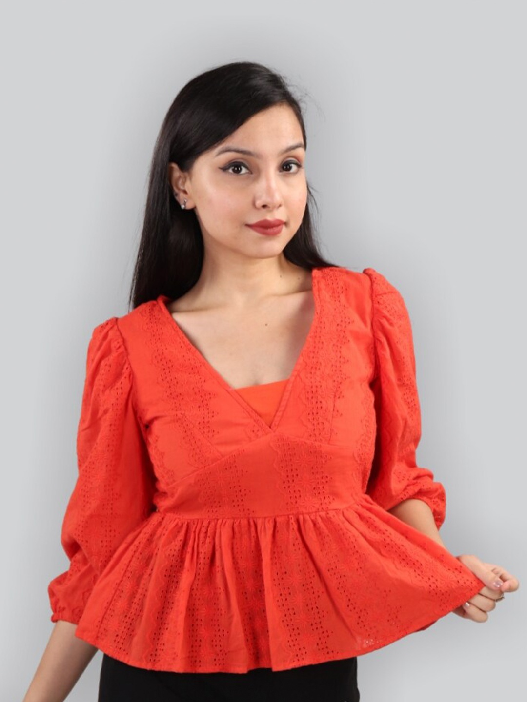 

The Label Bar Orange Schiffli Peplum Top