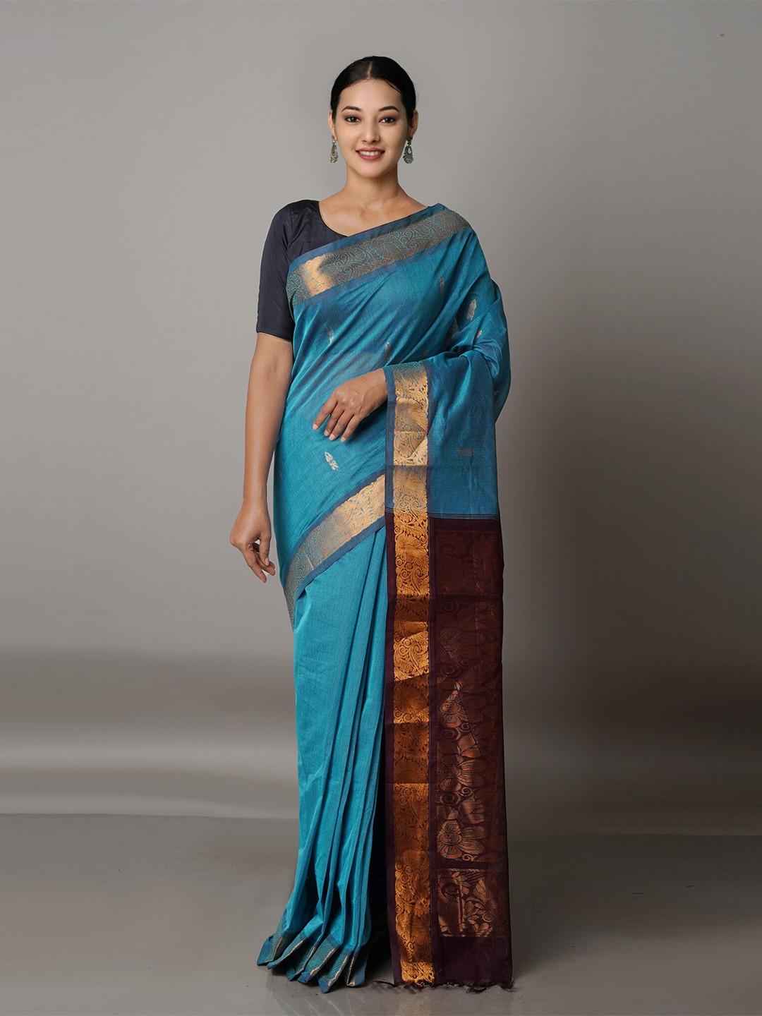 

Unnati Silks Blue & Brown Ethnic Motifs Zari Pure Cotton Gadwal Saree