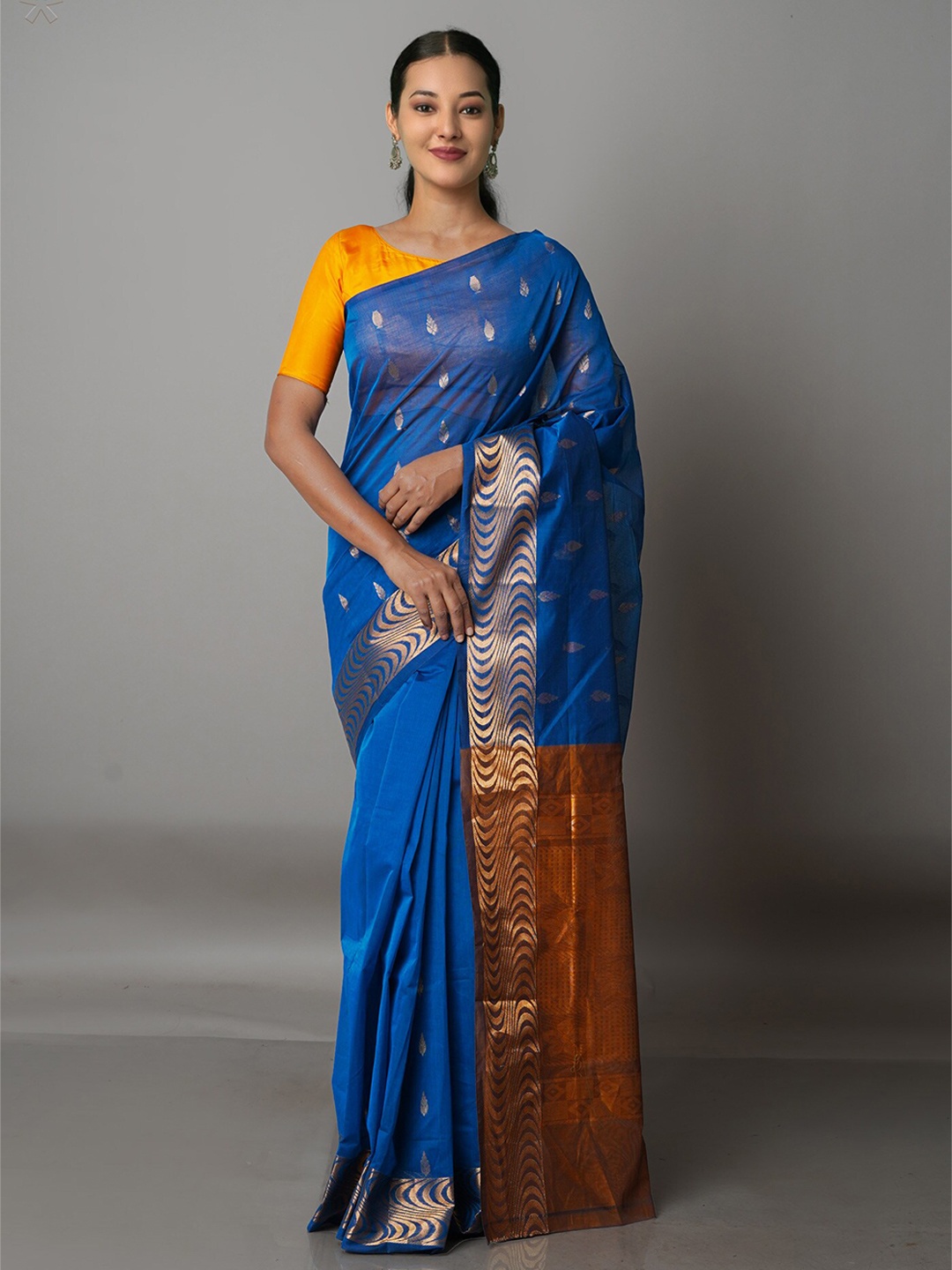 

Unnati Silks Blue & Brown Ethnic Motifs Zari Pure Cotton Gadwal Saree