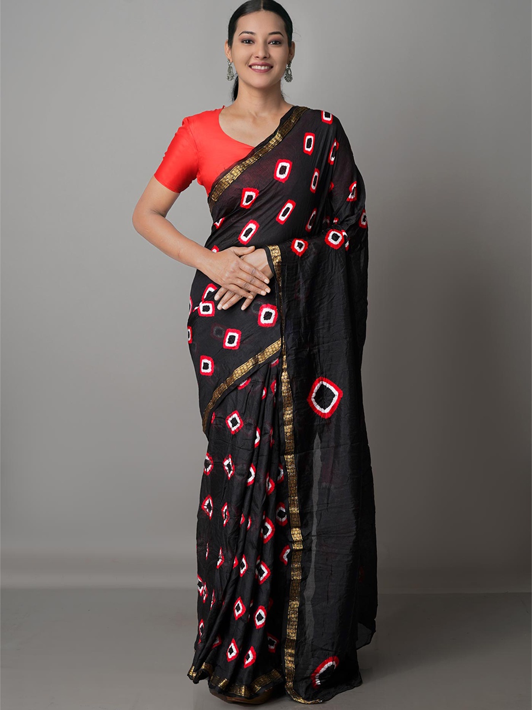 

Unnati Silks Black & Orange Bandhani Zari Soft Silk Bandhani Saree