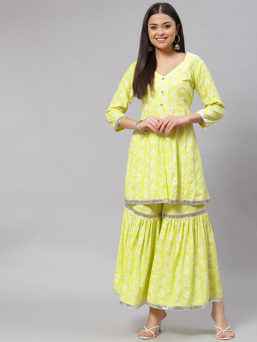 

mokshi Women Yellow Ethnic Motifs Printed Panelled Kurta with Sharara