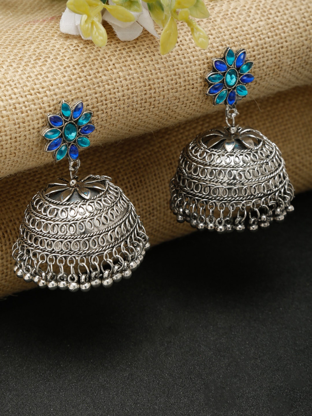 

Dhrohar Blue & Silver-Plated Oxidised Contemporary Jhumkas Earrings