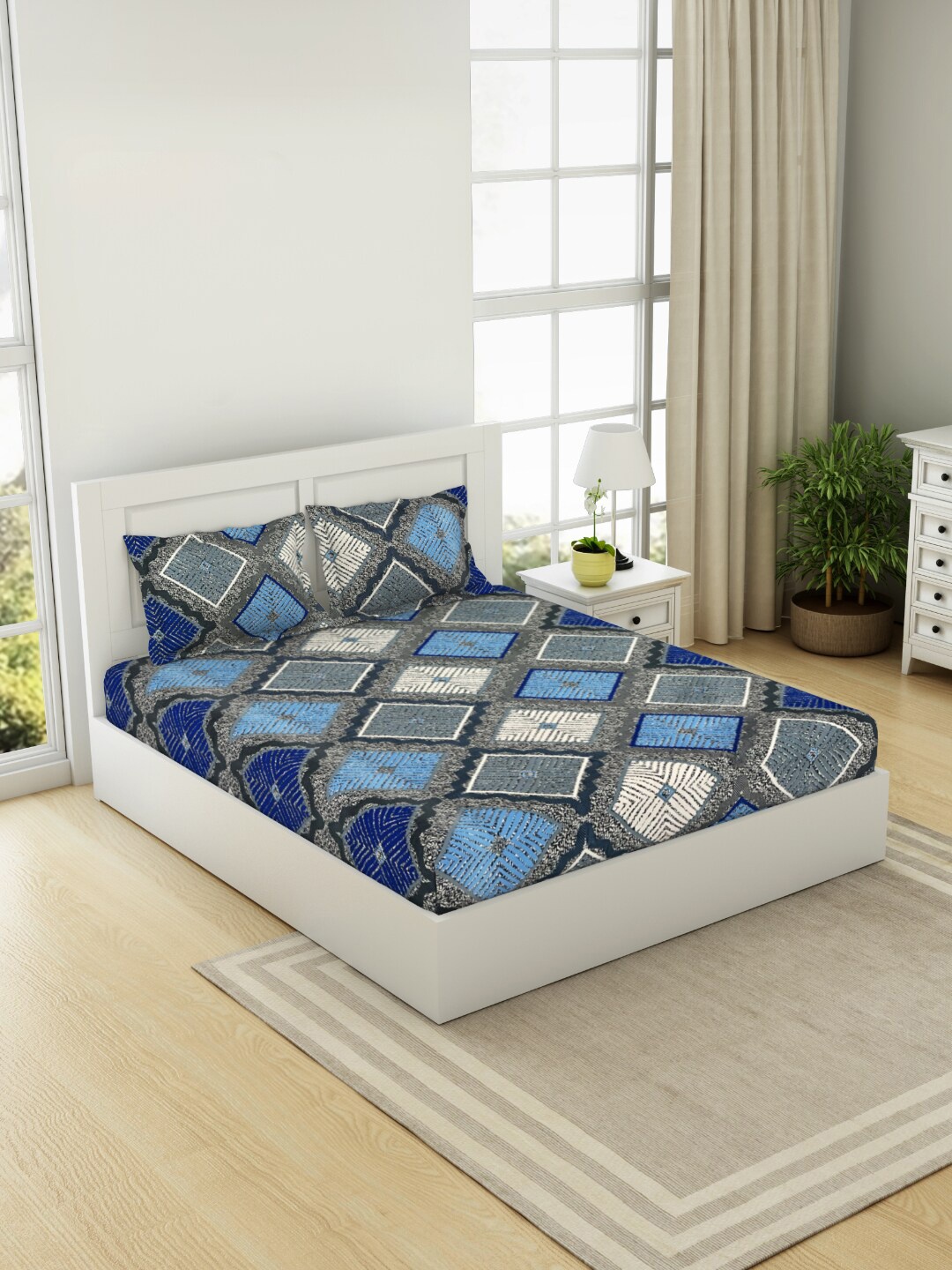 

Welspun Blue Geometric 144 TC Cotton Queen Bedsheet with 2 Pillow Covers
