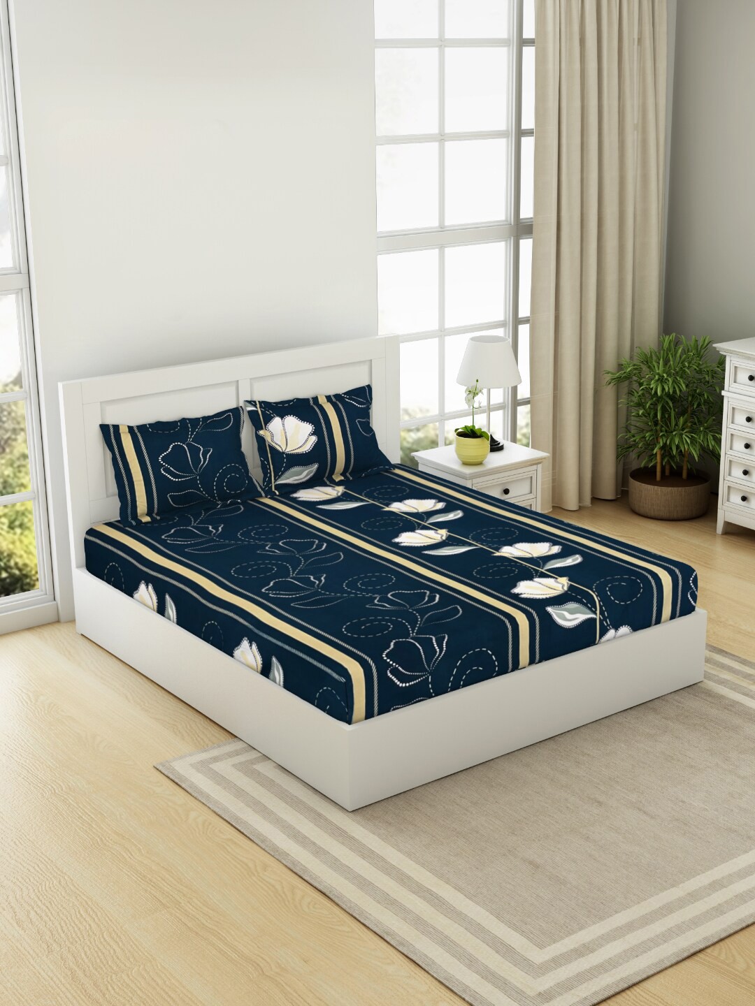 

Welspun Navy Blue Floral 144 TC Queen Bedsheet with 2 Pillow Covers