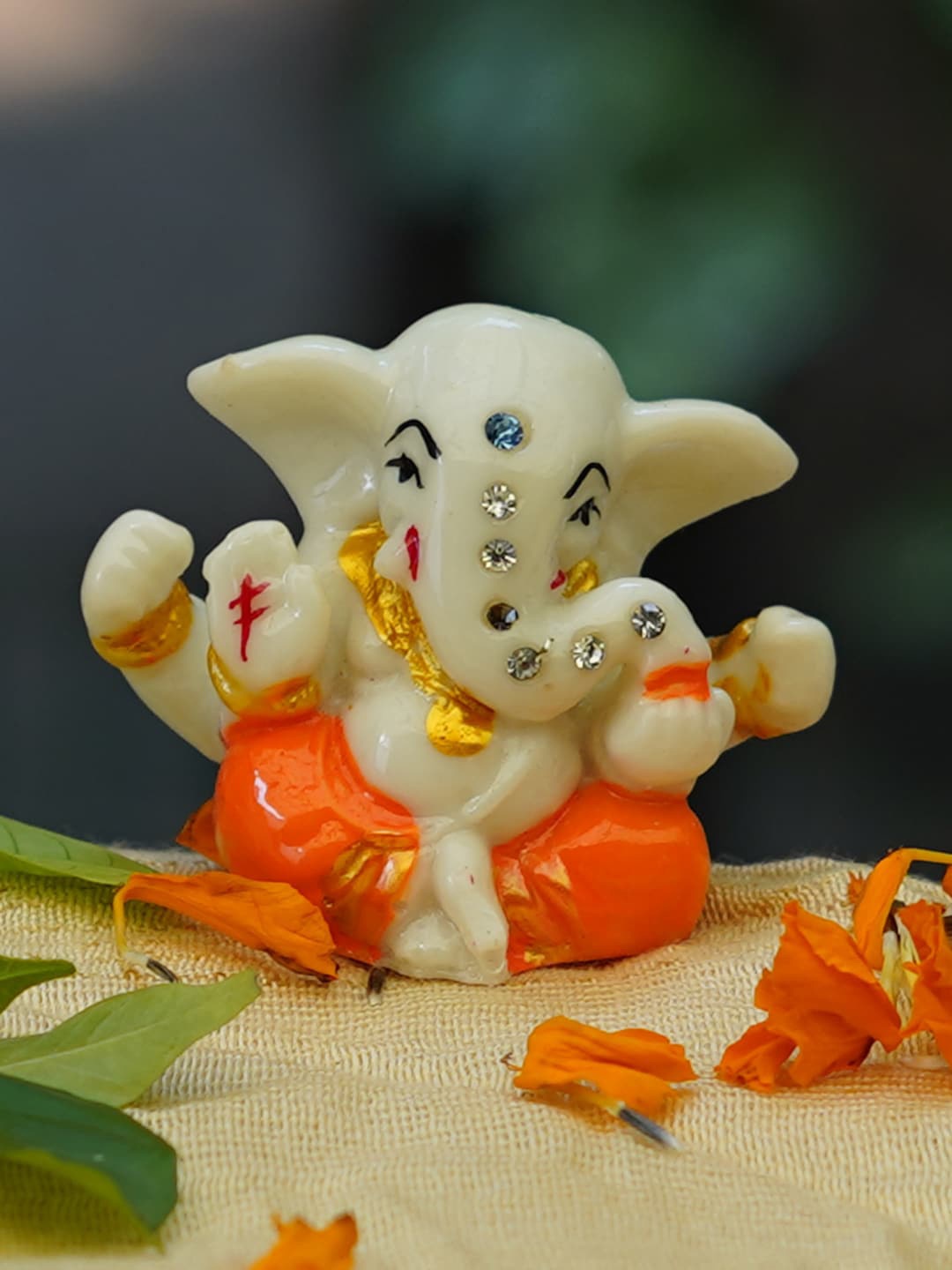 

Gallery99 White & Orange Marble Hand-painted Ganesh Idol Showpieces