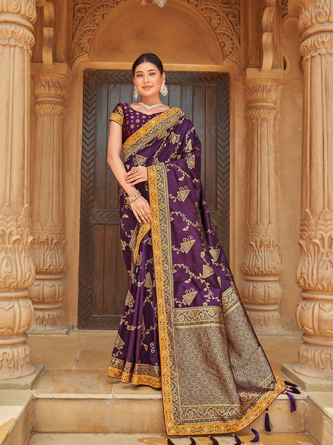 

MONJOLIKA FASHION Purple & Gold-Toned Ethnic Motifs Zari Banarasi Saree