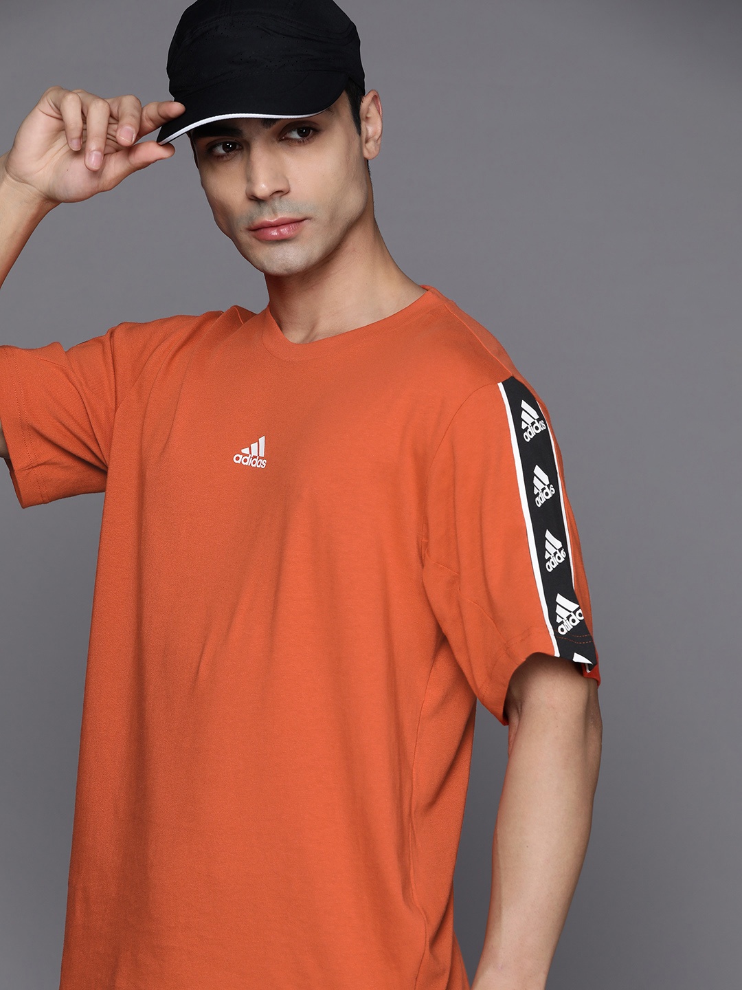 

ADIDAS Men Solid Brandlove Pure Cotton T-shirt, Rust