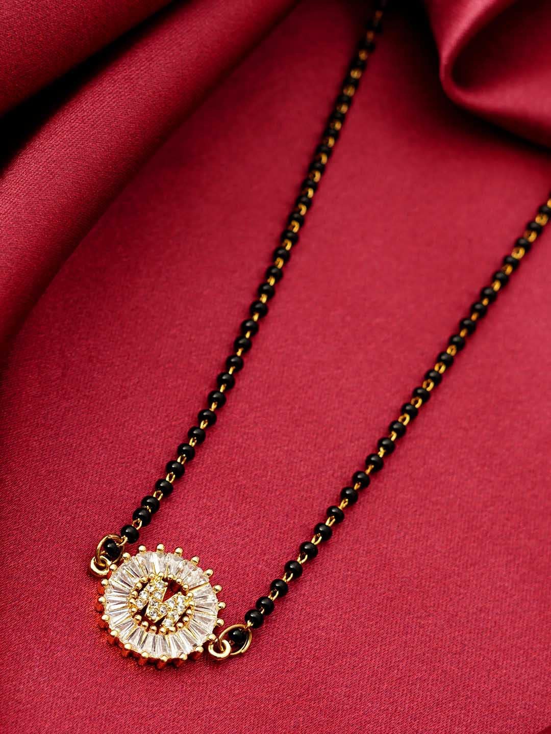 

Ferosh Black & White Gold-Plated Stone Studded & Beaded M Alphabet Mangalsutra
