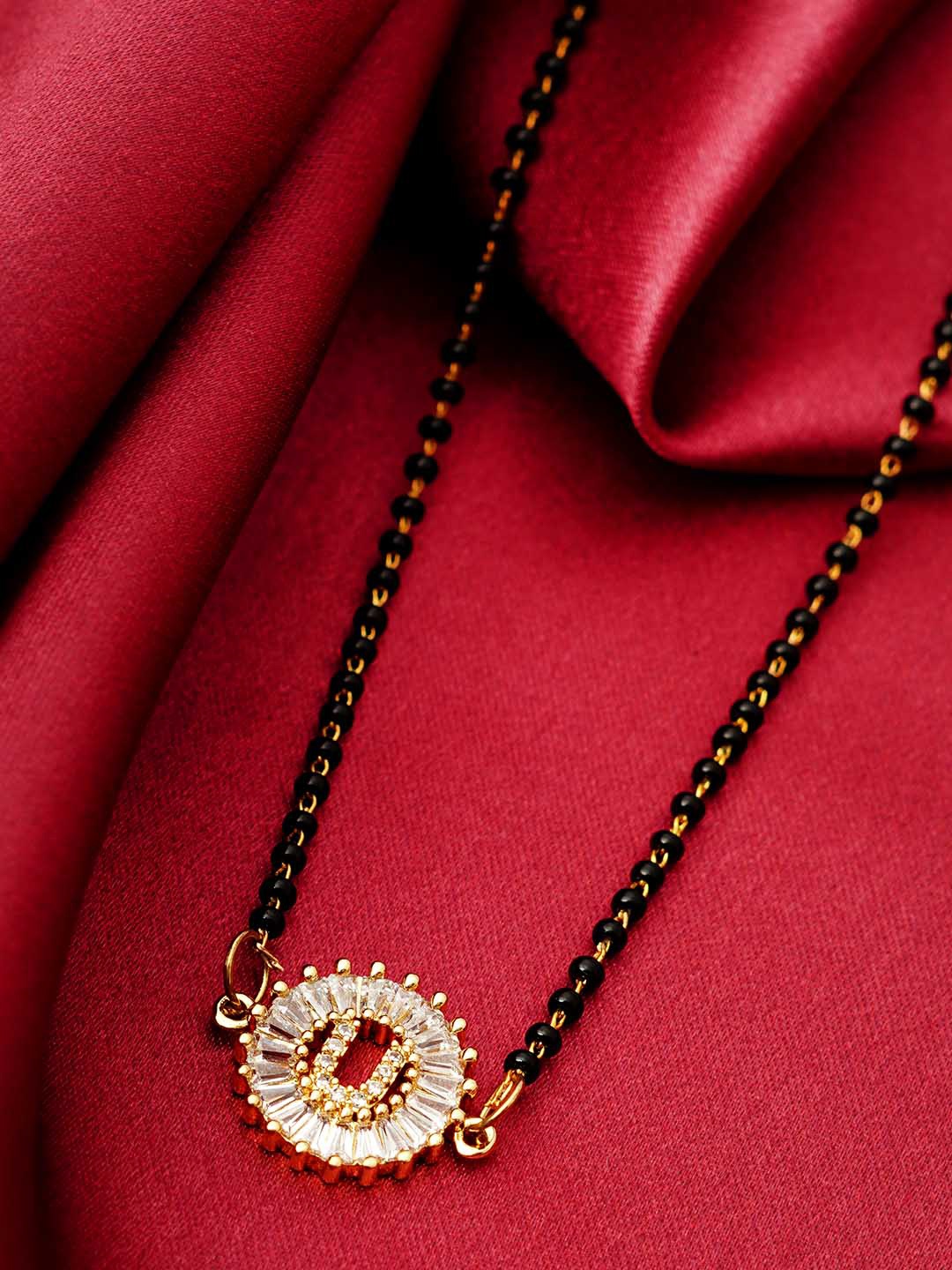

Ferosh Black & White Gold-Plated Stone Studded & Beaded U Alphabet Mangalsutra