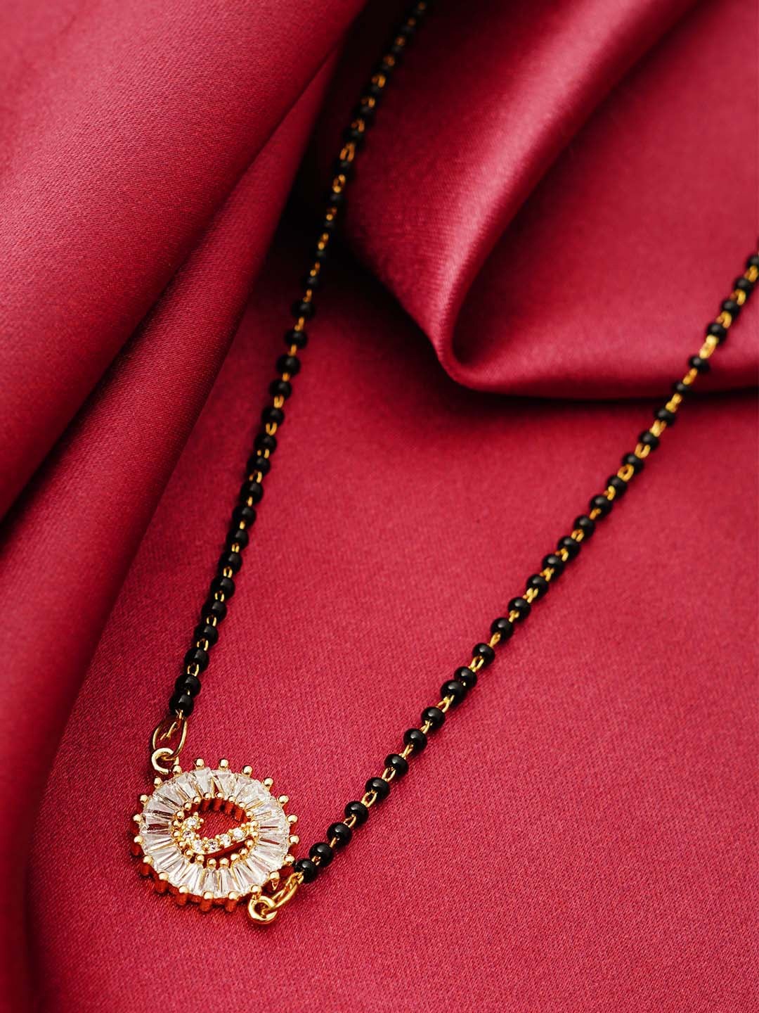 

Ferosh Black & White Gold-Plated Stone Studded & Beaded J Alphabet Mangalsutra