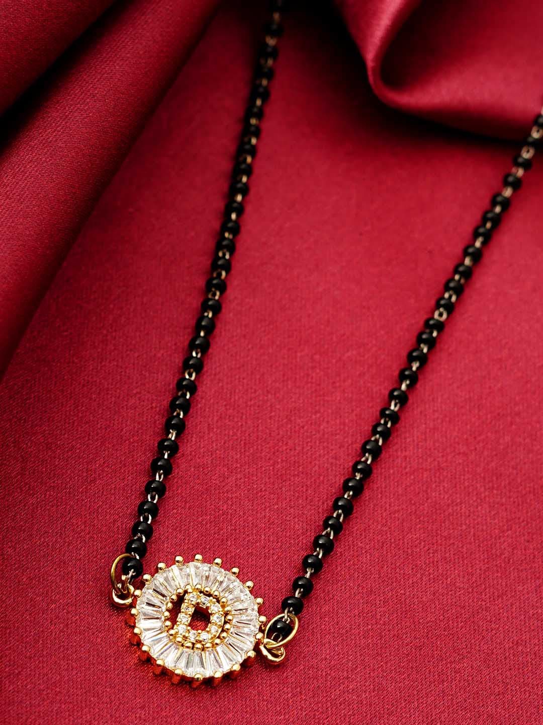 

Ferosh Black & White Gold-Plated Stone Studded & Beaded D Alphabet Mangalsutra