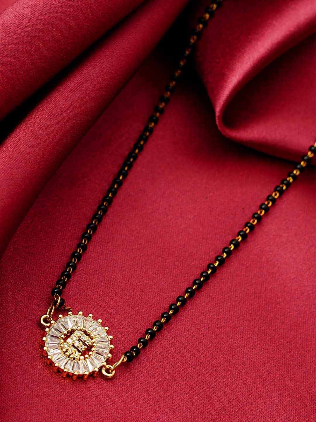 

Ferosh Black & White Gold-Plated Stone Studded & Beaded E Alphabet Mangalsutra