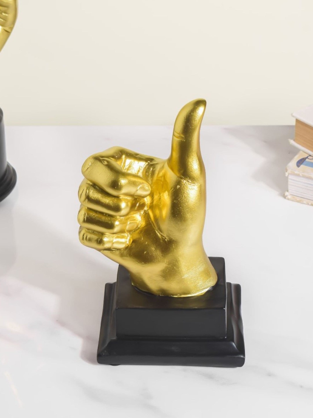 

Nestasia Gold-Coloured Solid Thumbs Up Showpieces