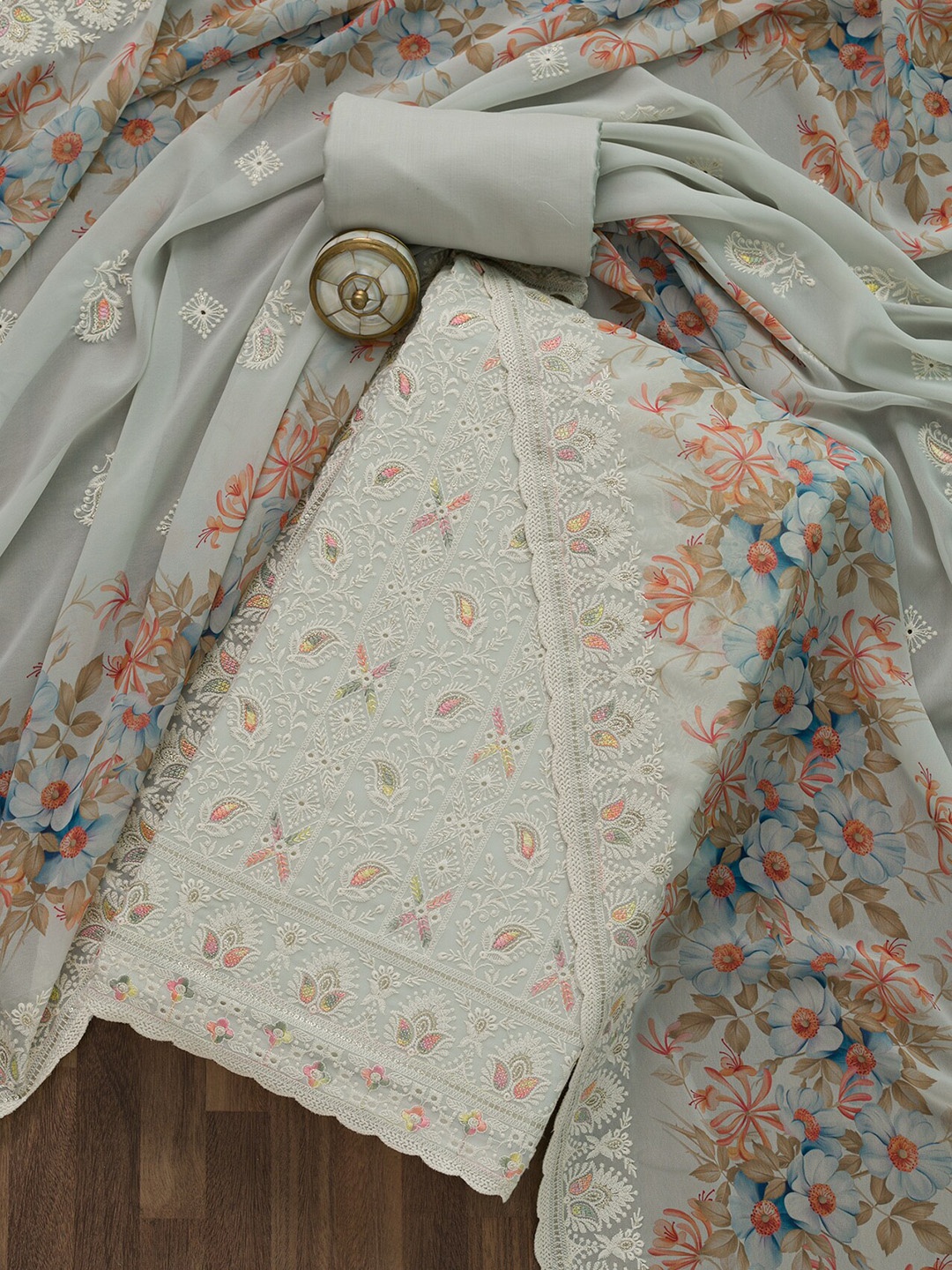 

Koskii Grey & Orange Embroidered Unstitched Dress Material
