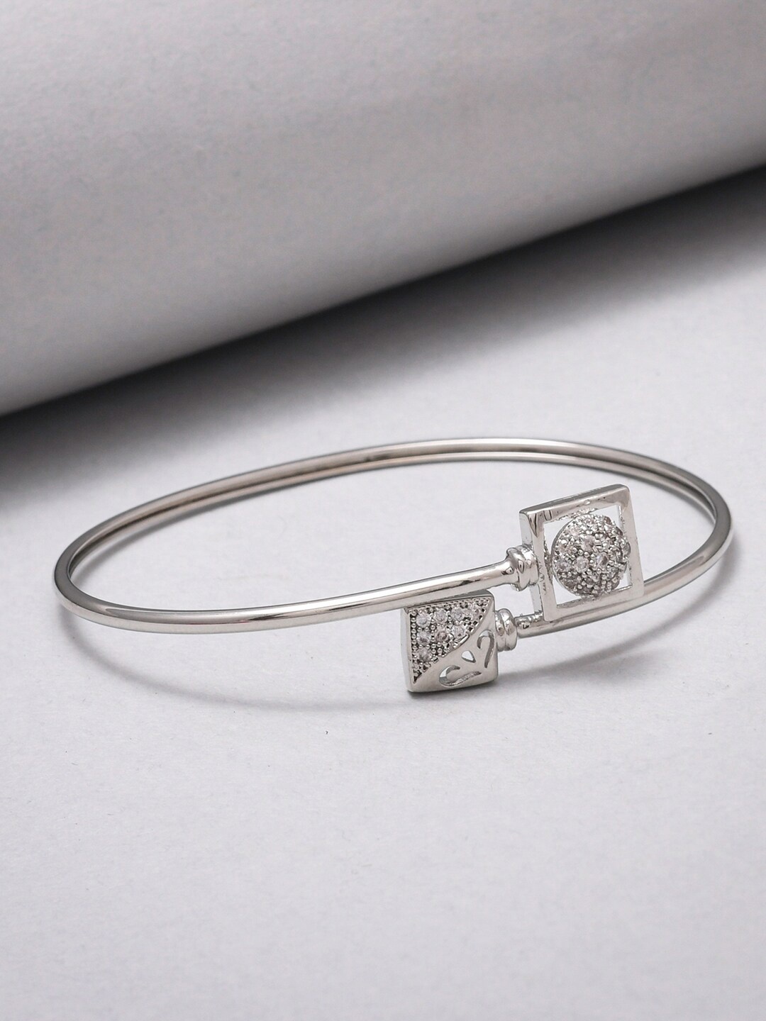 

Voylla Women Silver-Toned Brass Rhodium-Plated Bangle-Style Bracelet