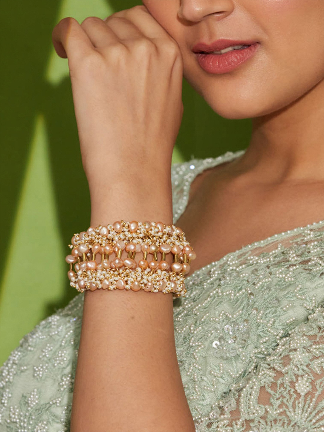 

D'oro Women Gold-Toned & Peach-Coloured Pearls Gold-Plated Charm Bracelet