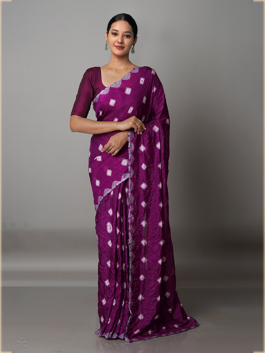 

Unnati Silks Purple & White Bandhani Silk Blend Bandhani Saree