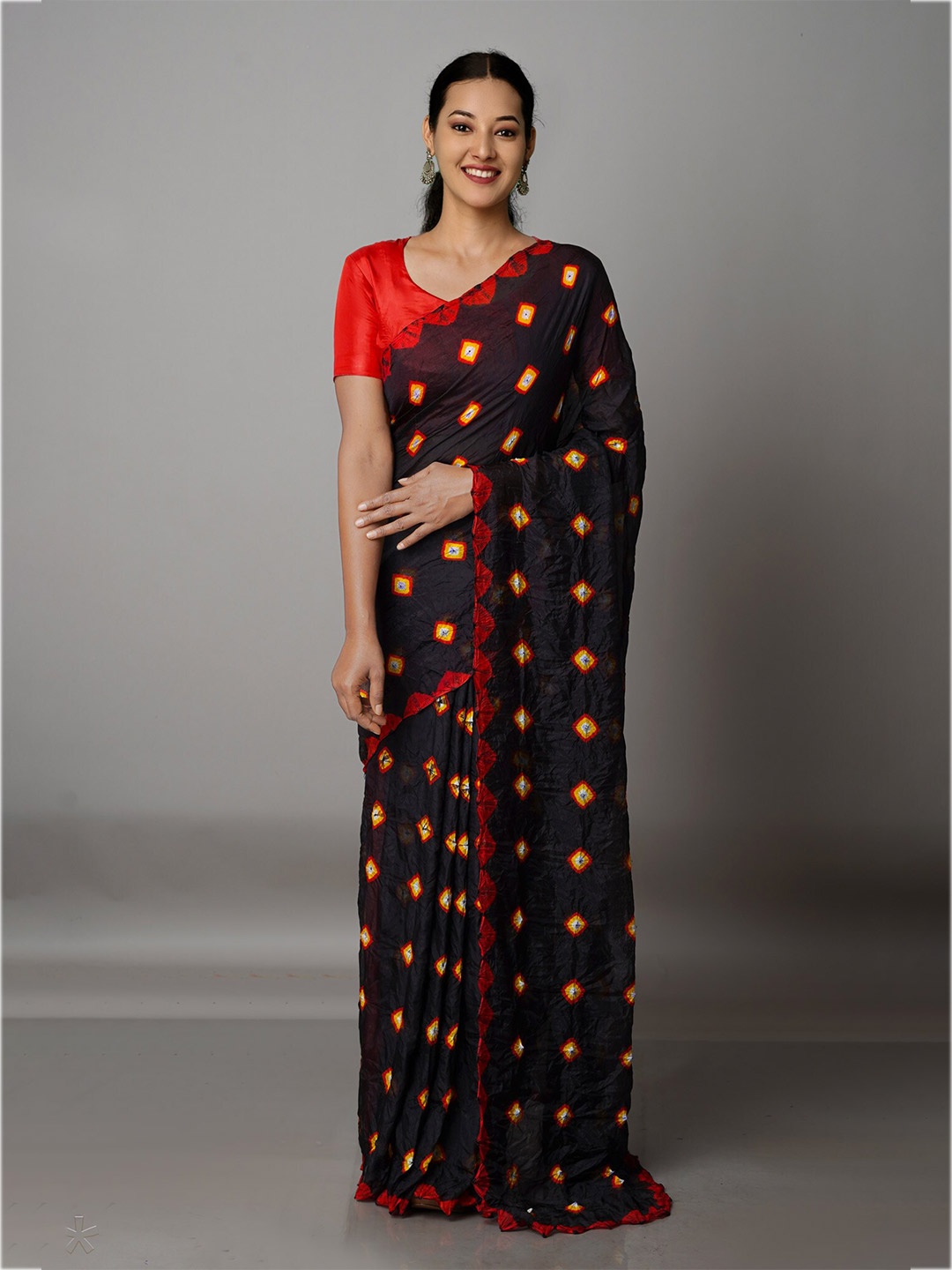 

Unnati Silks Black & Red Bandhani Silk Blend Bandhani Saree