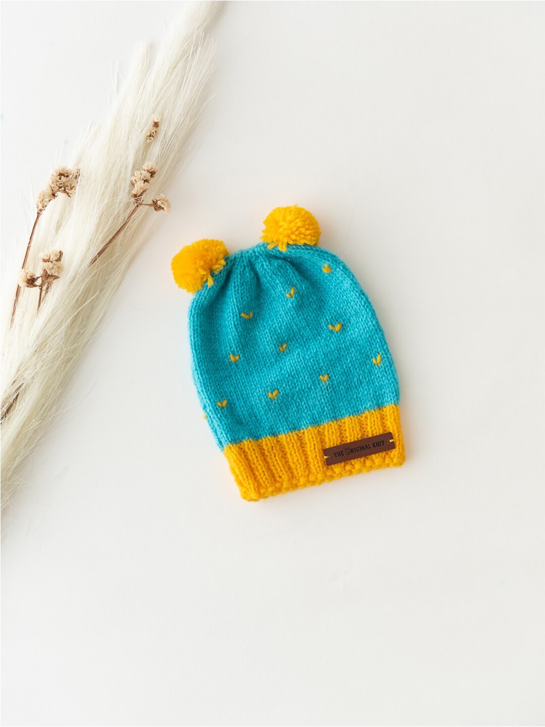 

The Original Knit Kids Blue & Yellow Self Design Acrylic Beanie Pom Pom Cap
