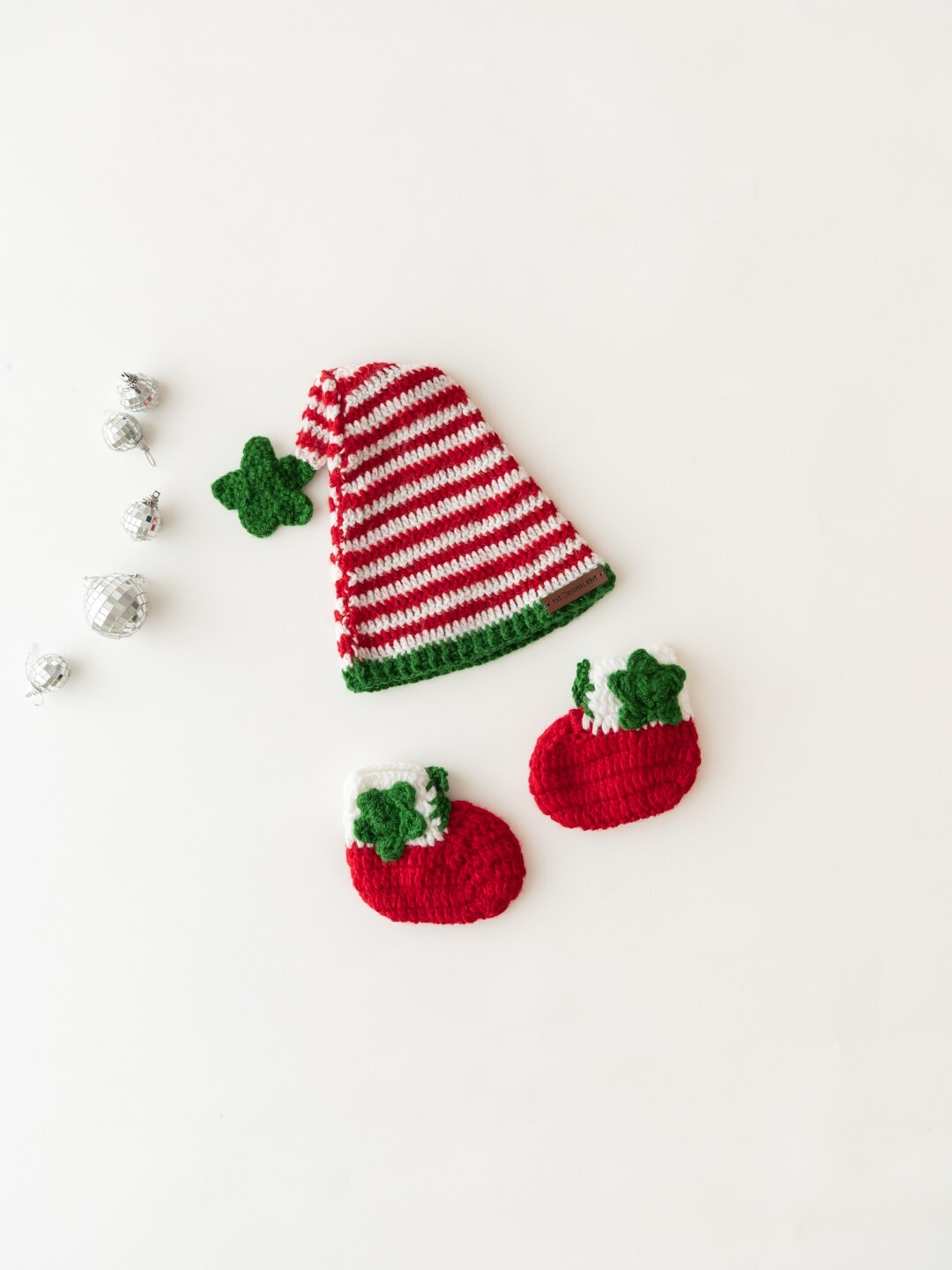 

The Original Knit Kids Red & White Self Design Striped Acrylic Cap With Booties