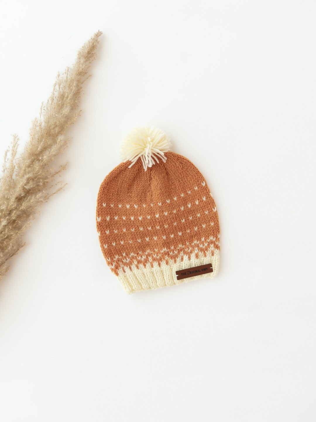 

The Original Knit Kids Brown & Cream-Coloured Self Design Acrylic Beanie Cap